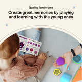 A white, gingered hair little boy looking at the book included at My Geo-Blox : Sorting Blocks Set Toy for Kids - BEST LEARNING